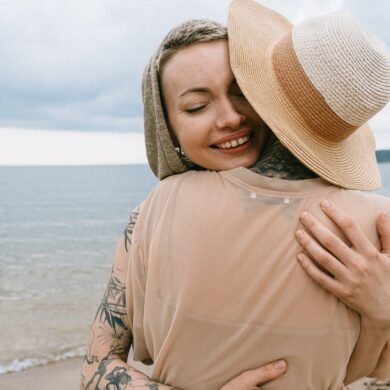 photo of women hugging each other