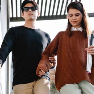photo of woman assisting man