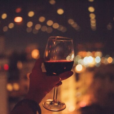 person holding cup of wine