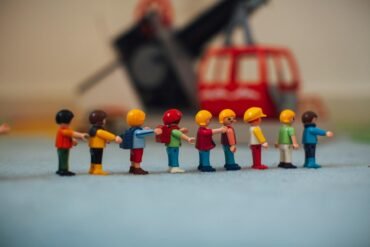 playmobil figures forming a line