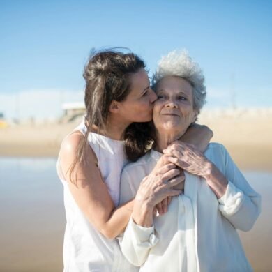 woman kissing her mother on the cheek